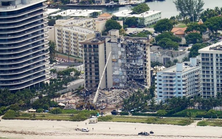 Death toll from building collapse in Miami rises.