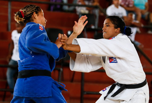 Caption: Anaily Dorvigny Hernández (right), outstanding judoka from San Nicolás.